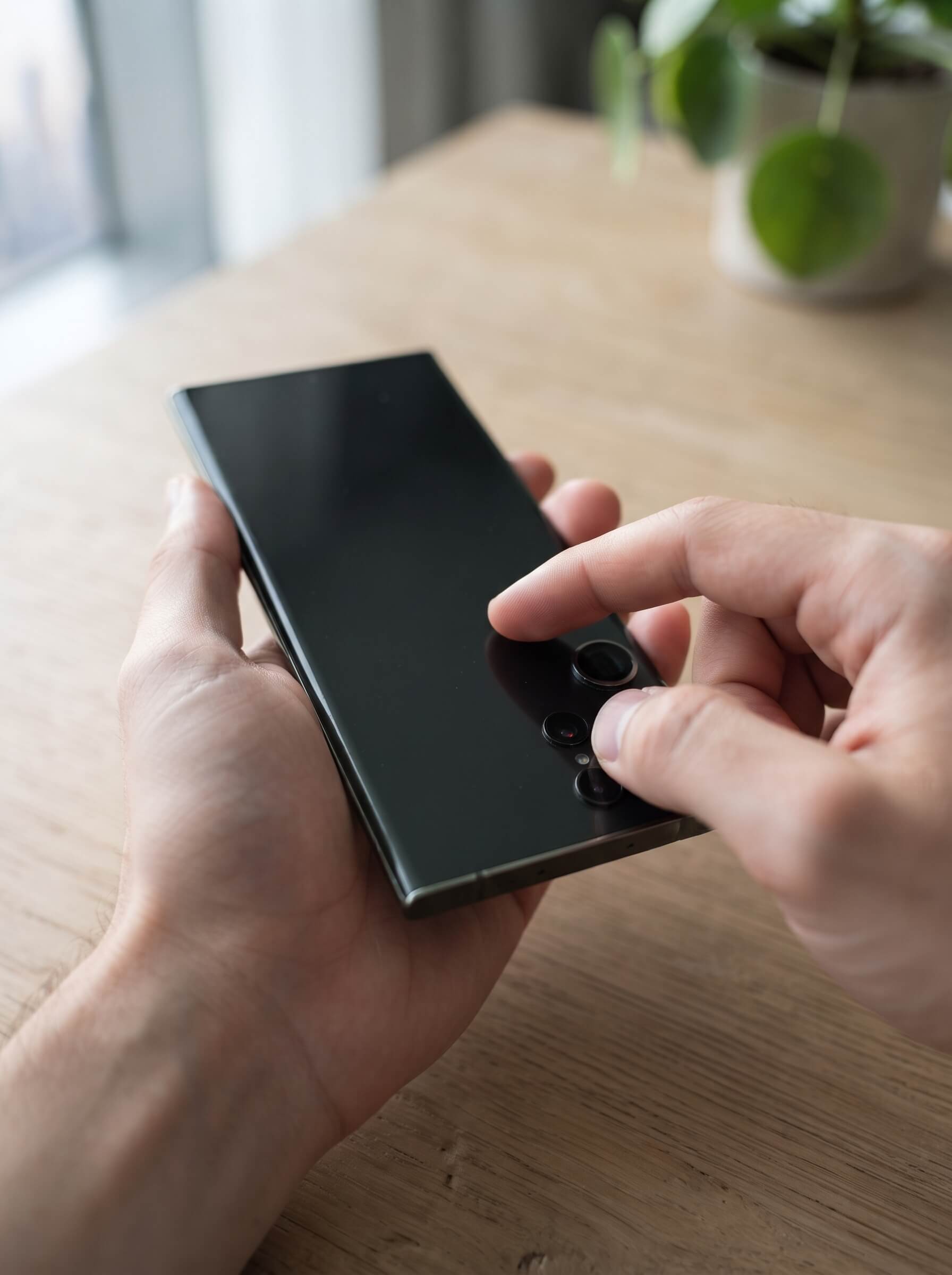 Inspecting a Samsung Galaxy Ultra phone condition before resale in Dubai.jpeg
